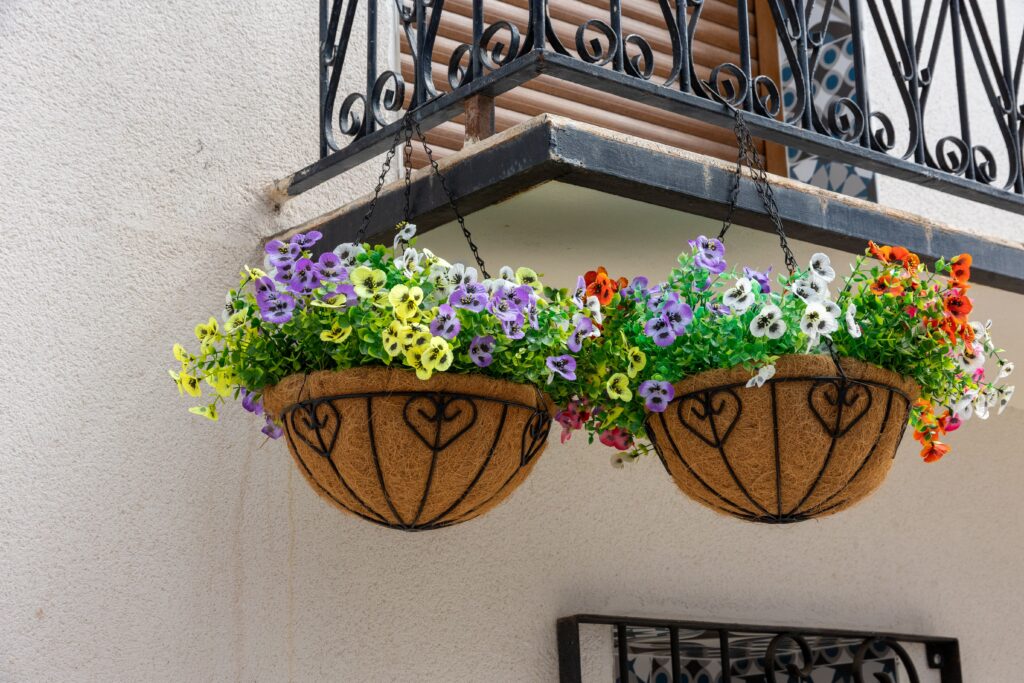Hang baskets of flowers